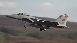 Windy day take offs of four F-15 Eagles