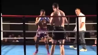 Papua New Guinean Kickboxer spin kicks a much taller opponent to sleep (knock out)