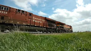 KCS & CP Locomotives with hopper cars & tanker cars traveling through Elkhart, Iowa