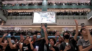 HK demonstrators rock new protest anthem | AFP