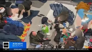 Dozens of migrants sleeping on floor at Logan Airport