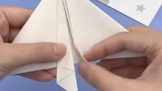 paper orgami flying airplane with straw