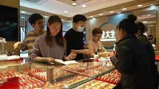 Youth appetite for gold rises as Chinese economy loses lustre | AFP