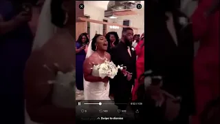 Bride walks down the aisle while singing to groom