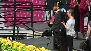 Paralyzed student walks across graduation stage