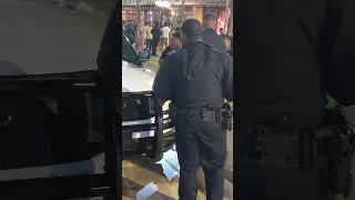 Black kid being searched and arrested by Tampa police in Ybor City. Party scene. Hot ladies walking.