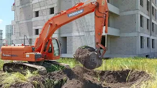 Doosan excavator is digging for build garage entrance