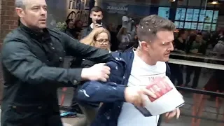 Milkshake thrown at Tommy Robinson