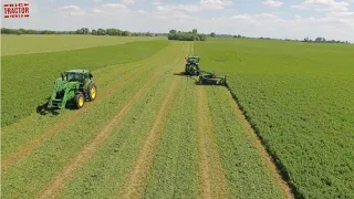 JOHN DEERE Tractors at Work on a Farm Mowing Hay