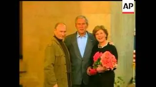 Outgoing Russian leader Vladimir Putin greeted President Bush and the First Lady in Sochi, Russia ah