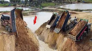 Wonderful filling Land Processing! Dump trucks unloading soiled into water for fill up land