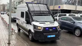responding national police of Ukraine with siren and lights drive around kyiv