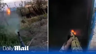 Ukraine soldiers clear buildings with grenades after capturing village from Russians near Bakhmut