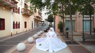 A bride had to run for cover as she was posing for photos in Beirut moments before the explosion