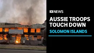 First Australian personnel have arrived in the Solomons as protests spill into third day | ABC News
