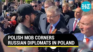 Russian Envoy refuses to remove Victory Day ribbon even as mob surrounds him in Warsaw | Watch