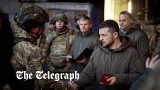 President Zelensky makes surprise visit to Bakhmut frontline as explosions are heard