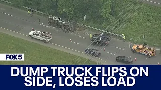 Dump truck flips on side, loses load in Upper Marlboro