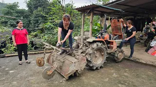 Mechanic girl repairs tractor with many broken parts