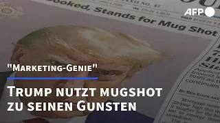 "Ein Marketing-Genie": Trump münzt Polizeifoto für Wahlkampf um | AFP