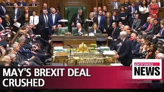 British PM May's Brexit deal suffers historic defeat in parliament