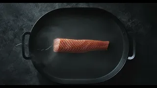 Stock Video: Salmon In A Pan With A Bit Of Water