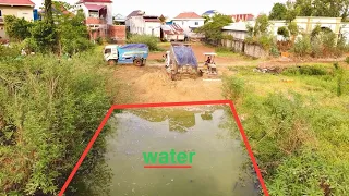 Strange activities​Dump Truck 5Ton Unloading soil into pond pushing soil by ​Komat'su D21P bulldozer