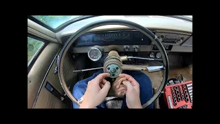 Removing a steering wheel on a 60's GM vehicle.