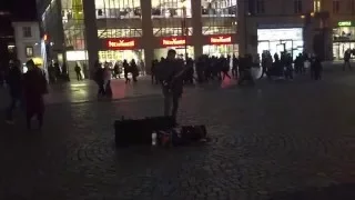 A street musician playing Gary Moore's The Loner in Budapest.