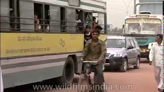 Delhi DTC bus services in 1990's, with people jumping off moving buses