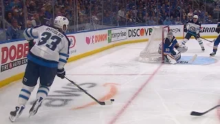 Dustin Byfuglien banks the puck in off Jordan Binnington