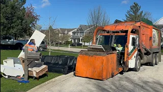 Flood Brothers Heil Front Loader Garbage Truck Packing Bulk at the Spring Cleanup