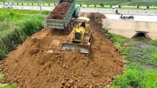 Filling Land and Building a Road with a KOMATSU D51P Dozer Pushing Soil and a Truck Spreading Soil