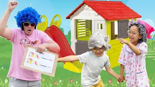 Lauren and Alexander plays dress up for Smoby playhouse and slide