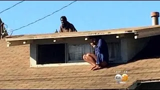 Woman Hides From Mentally Ill Intruder On Roof