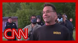 Sheriff takes off riot gear and joins peaceful protesters