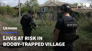 Ukrainian lives at risk in booby-trapped village | AFP