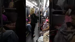 Guy hugging random people on Chicago subway