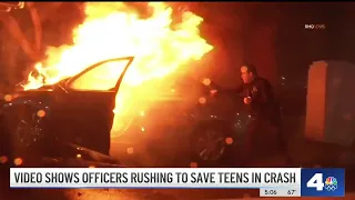 Video shows officers rush to save teens in crash