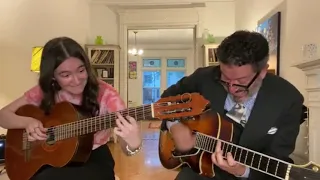 Madeleine and John Pizzarelli in a guitar performance
