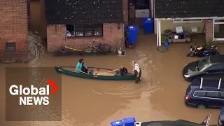 UK floods: Locals paddle through streets in southwest England