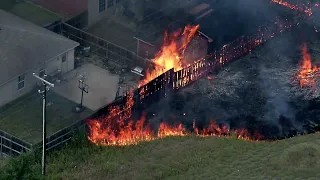 RAW Video:  Houses burn as fast-moving grass fire tears through Balch Springs neighborhood