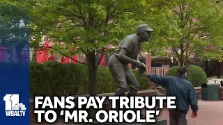 Fans pay respect at Brooks Robinson's statue at Legends Park