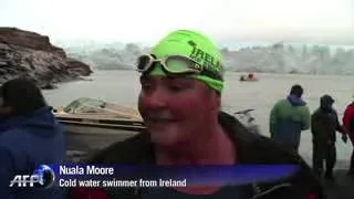 Amateur swimmers dive into cold waters of Perito Moreno glacier