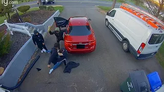 Moment homeowner fights off four car thieves in his driveway captured on CCTV