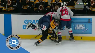 Brad Marchand ducks to avoid the hit and upends Garnet Hathaway