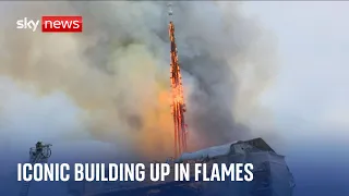 Spire falls after fire breaks out at Copenhagen's Old Stock Exchange building