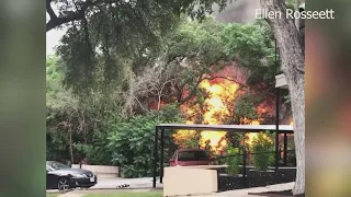 Big flames seen at abandoned structure with homes nearby, officials say