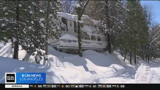 San Bernardino County continues to clear roads and get supplies to residents homebound by storm