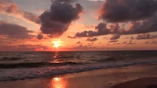 Music and sea waves.Sound of the waves and acoustic guitar